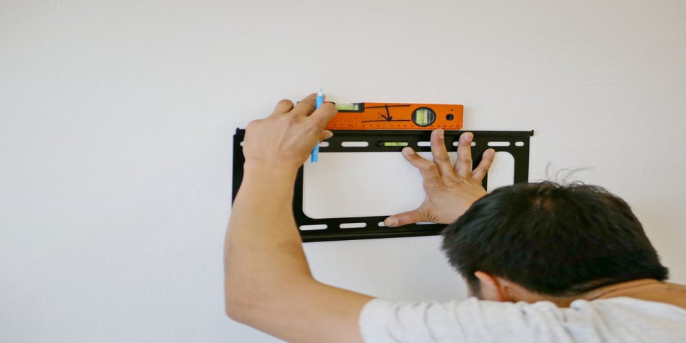 how to mount tv on concrete wall?